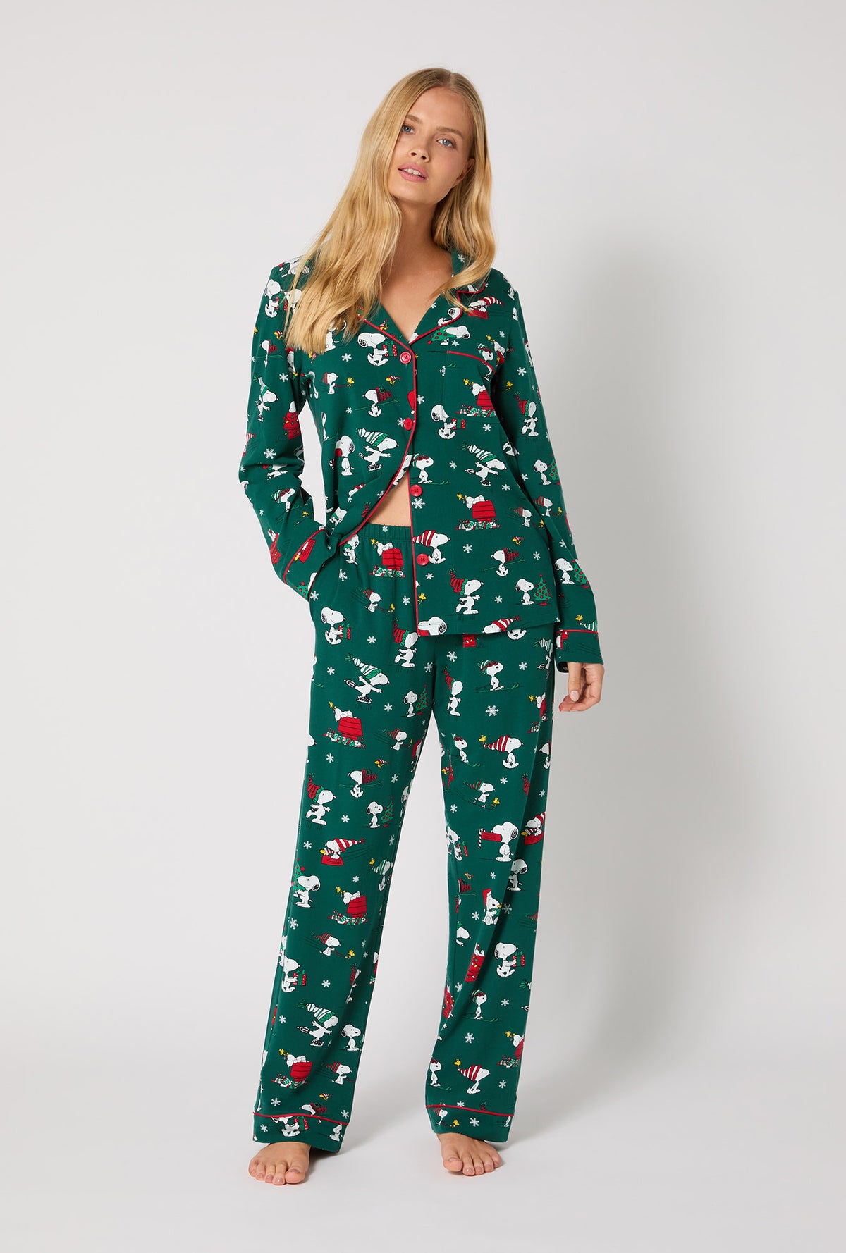 A lady wearing ®Snoopy's Holiday Fun Long Sleeve Classic Stretch Jersey Pj Set