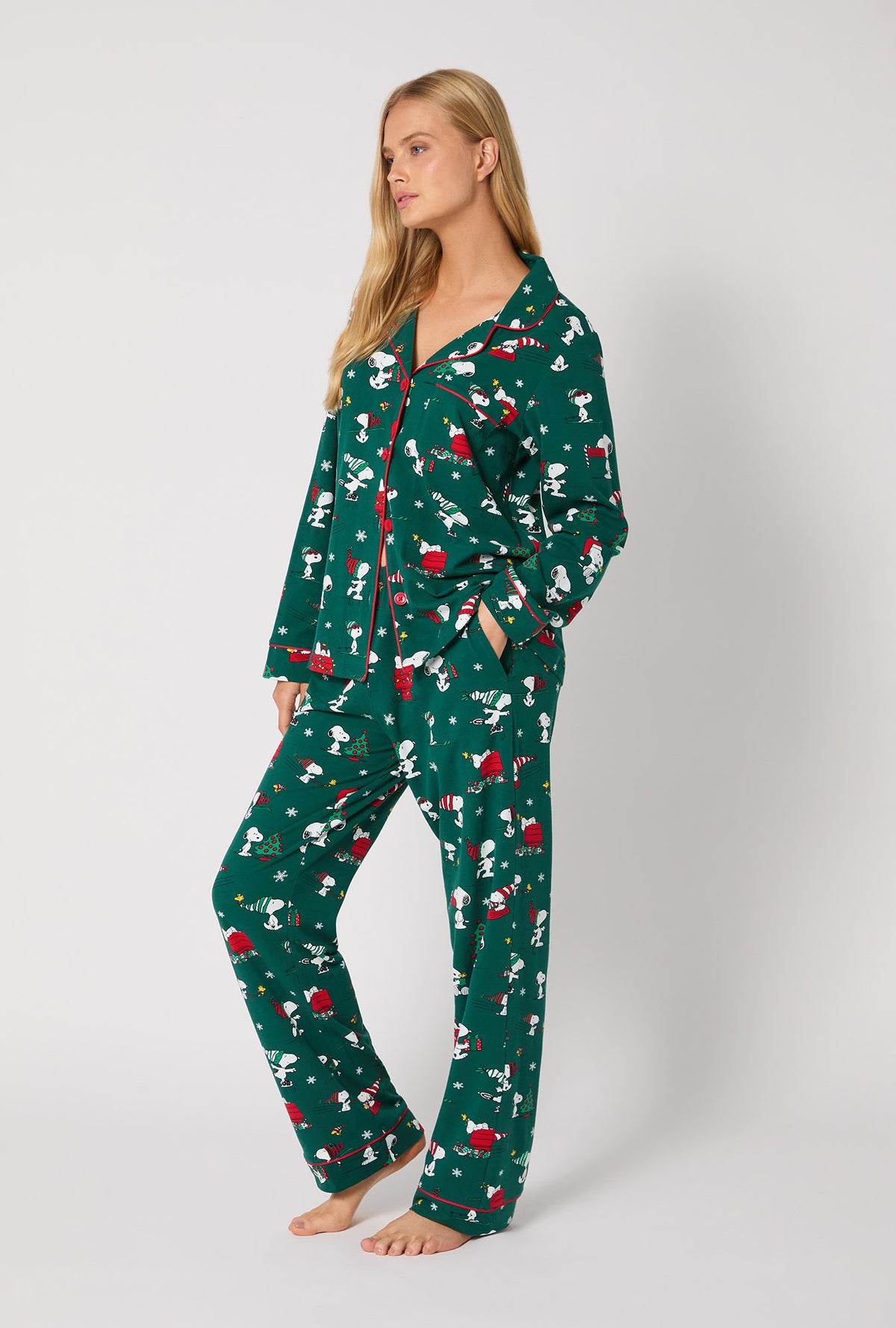 A lady wearing ®Snoopy's Holiday Fun Long Sleeve Classic Stretch Jersey Pj Set