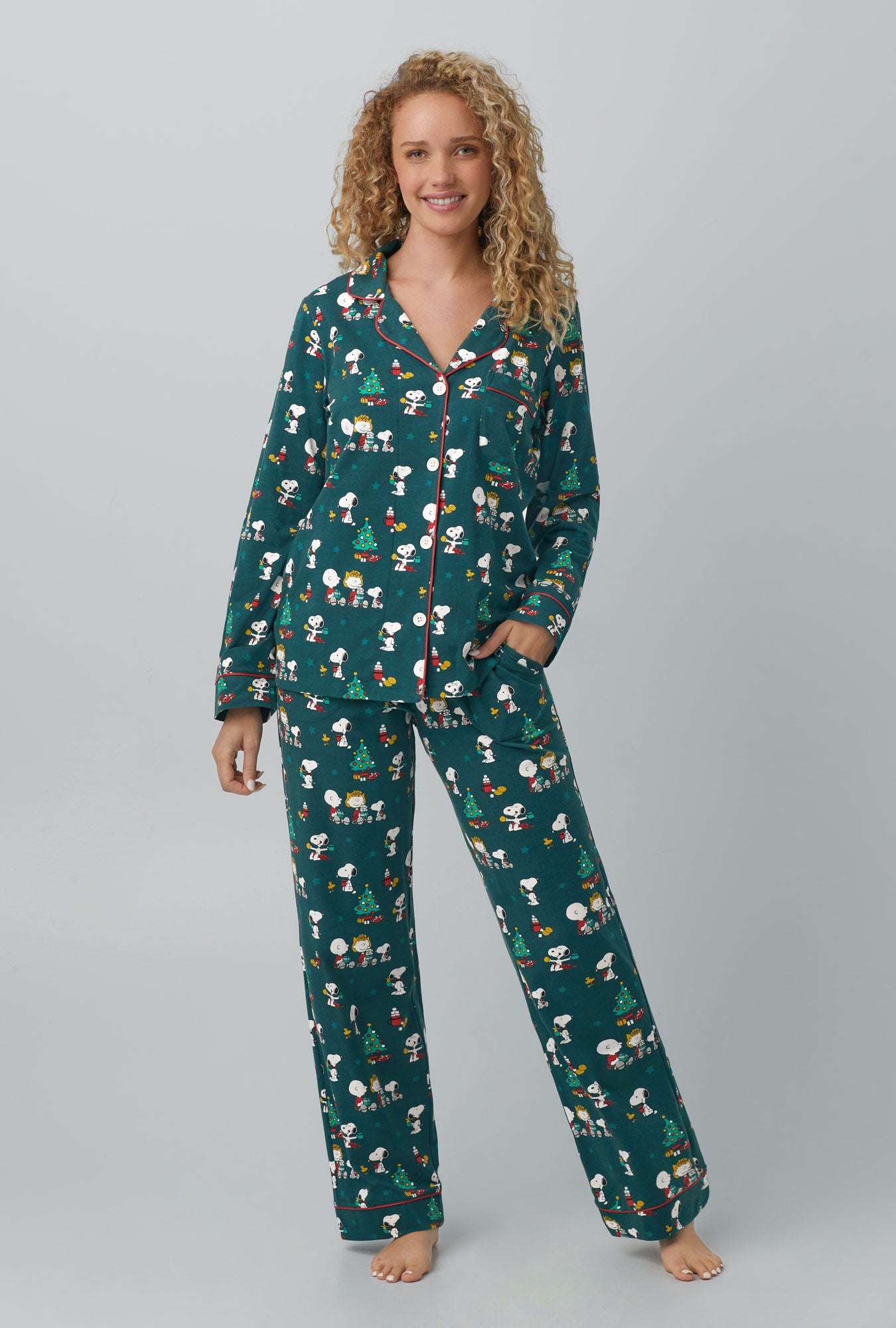 A lady wearing green Long Sleeve Classic Stretch Jersey PJ Set with Snoopy's Cocoa print
