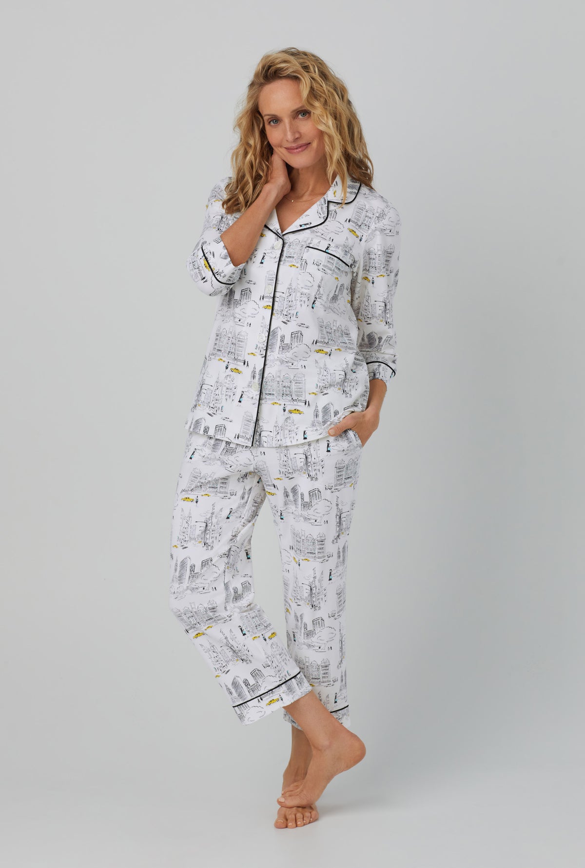 A lady wearing white  3/4 Sleeve Classic Stretch Jersey Cropped PJ Set with City That Never Sleeps  print