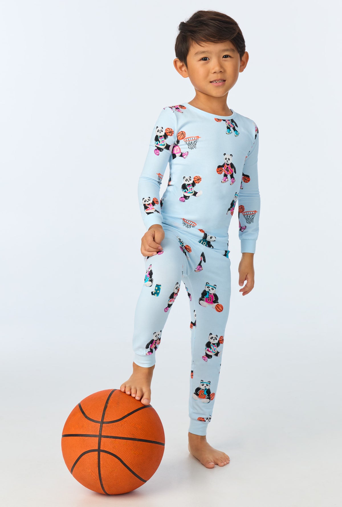 A girl wearing  Newport Slam Dunk Long Sleeve Stretch Jersey Kids PJ Set