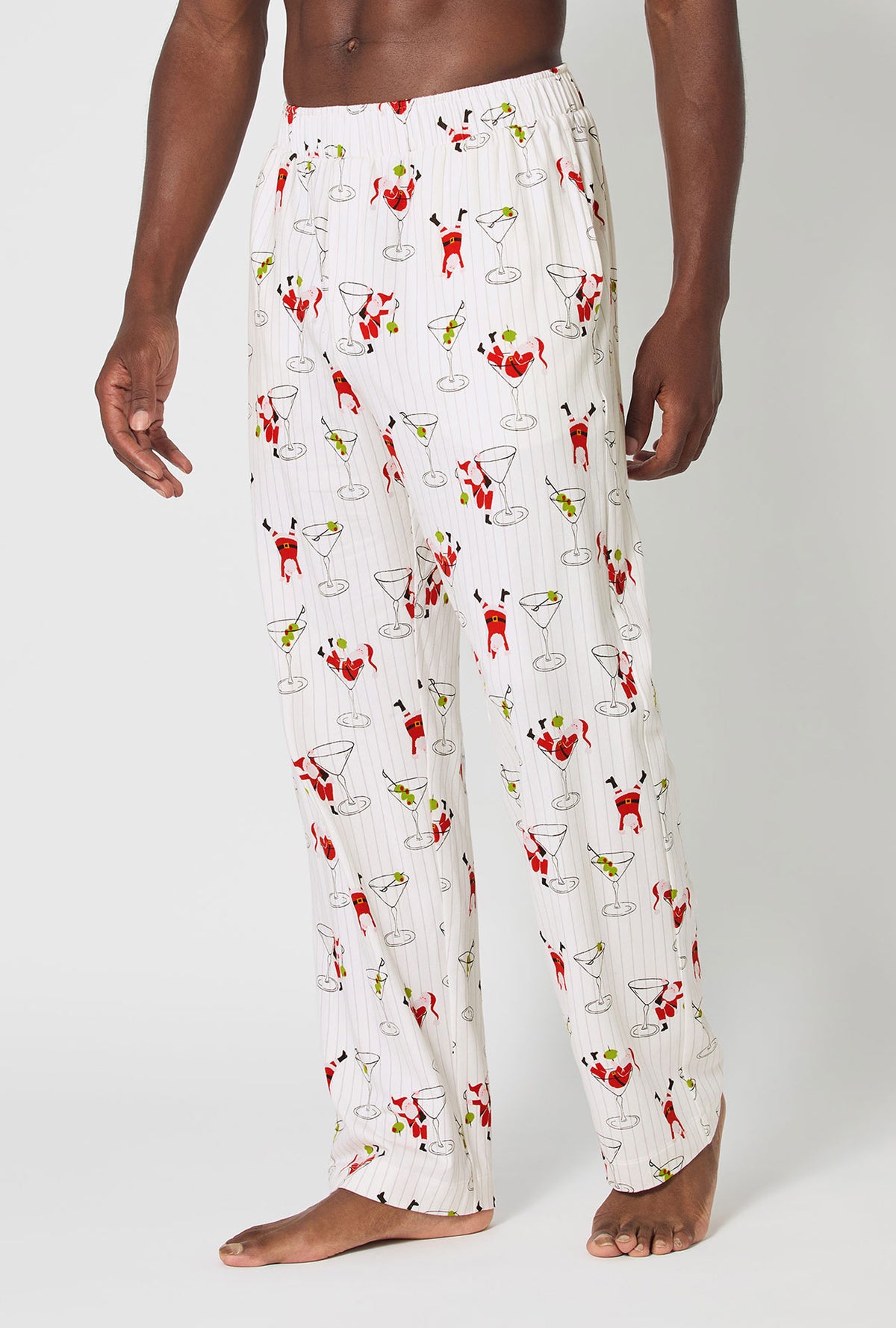 A man wearing Tipsy Santa Men&#39;s Stretch Jersey Pj Pant