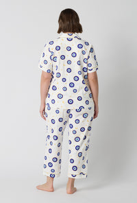A Lady Wearing Plus Size Eyeconic Short Sleeve Classic Stretch Jersey Cropped Pj Set in a back view pose