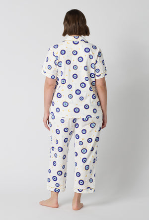 A Lady Wearing Plus Size Eyeconic Short Sleeve Classic Stretch Jersey Cropped Pj Set in a back view pose