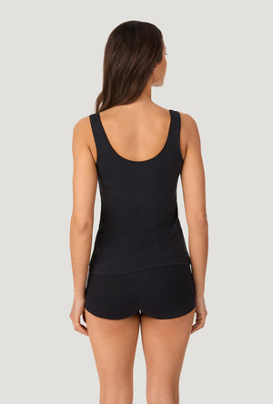 A lady wearing Black Stretch Jersey Tank back view