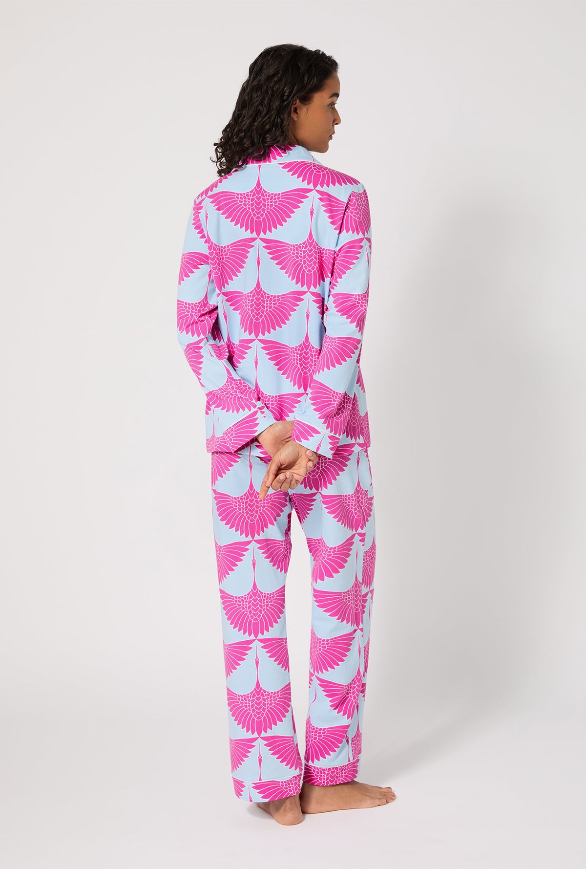 A lady wearing BedHead X Trina Turk Cranes Long Sleeve Classic Stretch Jersey PJ Set