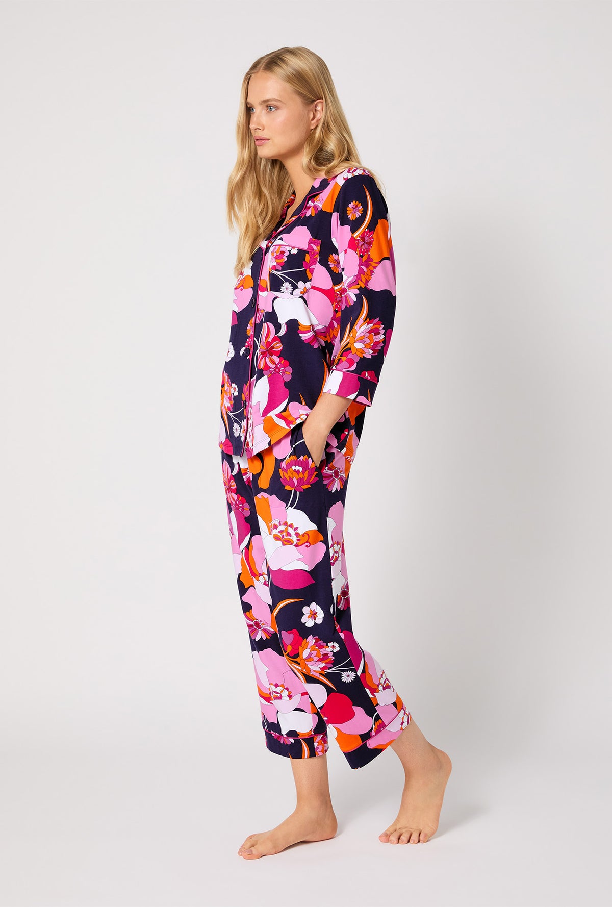 A lady wearing BedHead X Trina Turk Floral Medley 3/4 Sleeve Classic Stretch Jersey Cropped PJ Set
