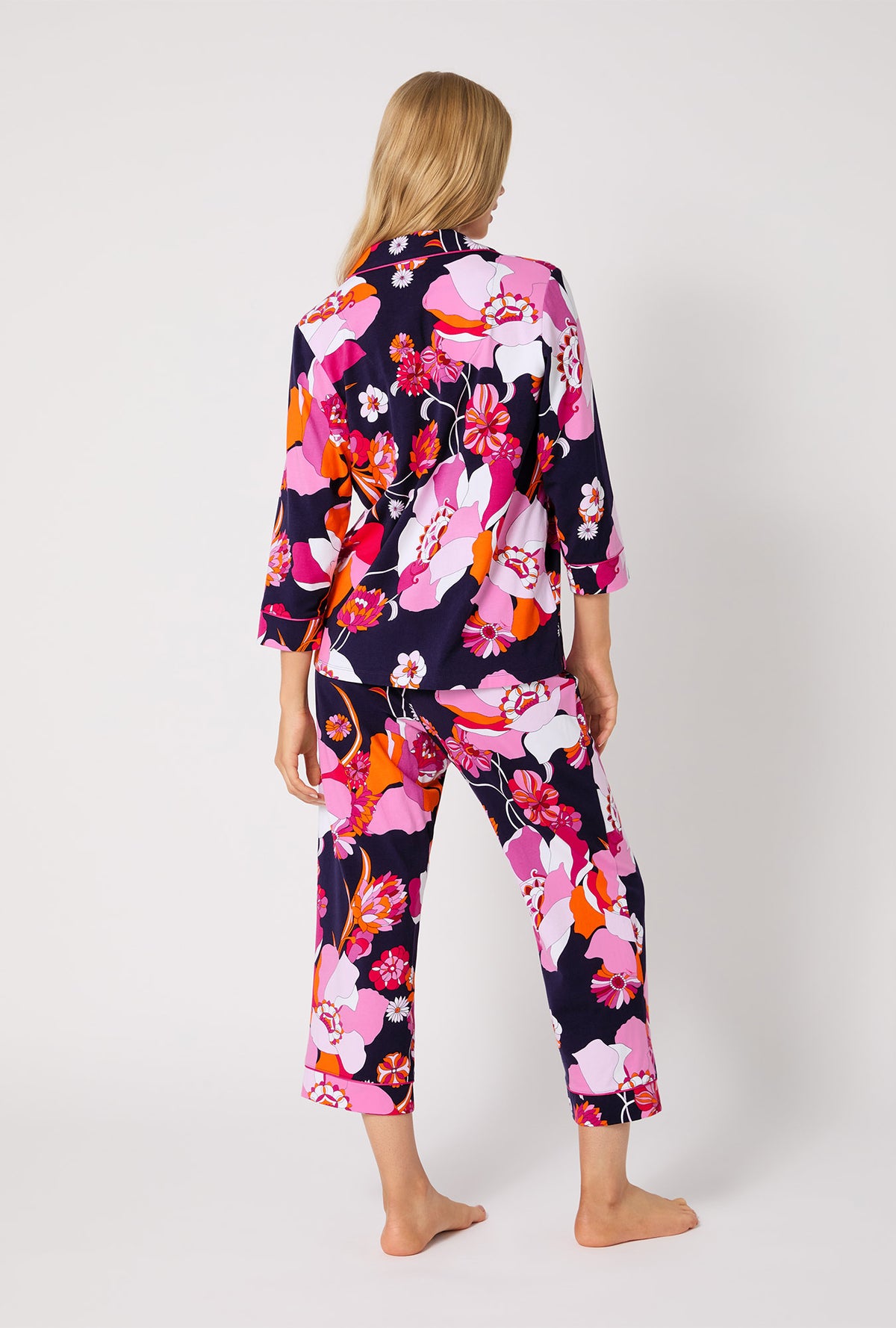 A lady wearing BedHead X Trina Turk Floral Medley 3/4 Sleeve Classic Stretch Jersey Cropped PJ Set