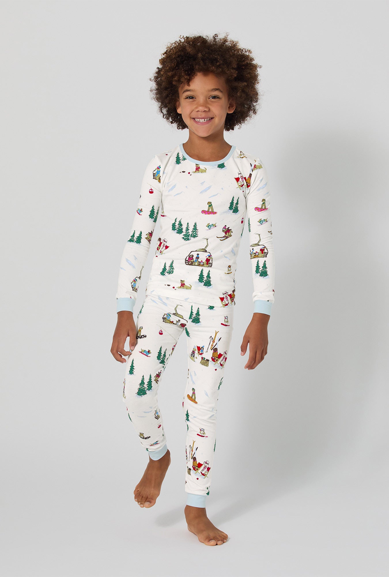 A girl wearing Ski Pups Long Sleeve Stretch Jersey Kids Pj Set