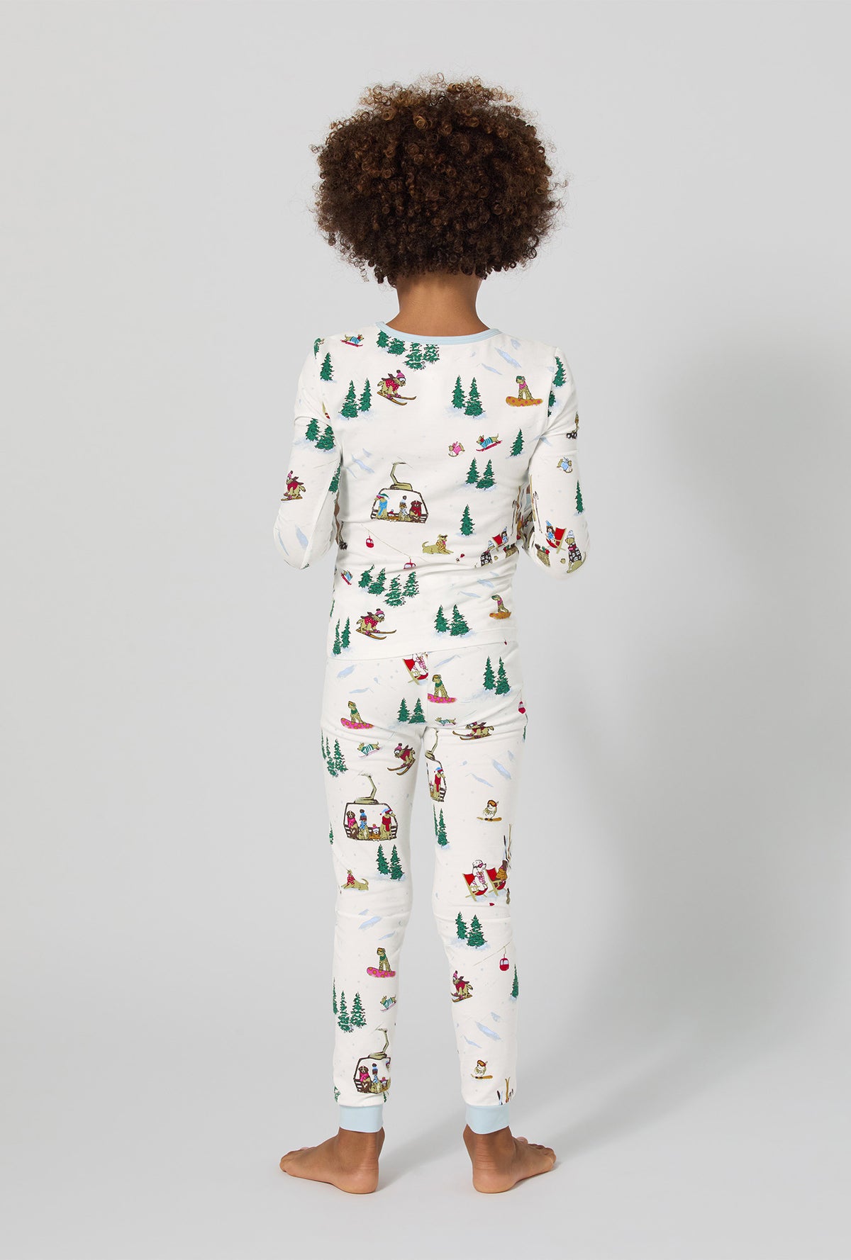 A girl wearing Ski Pups Long Sleeve Stretch Jersey Kids Pj Set