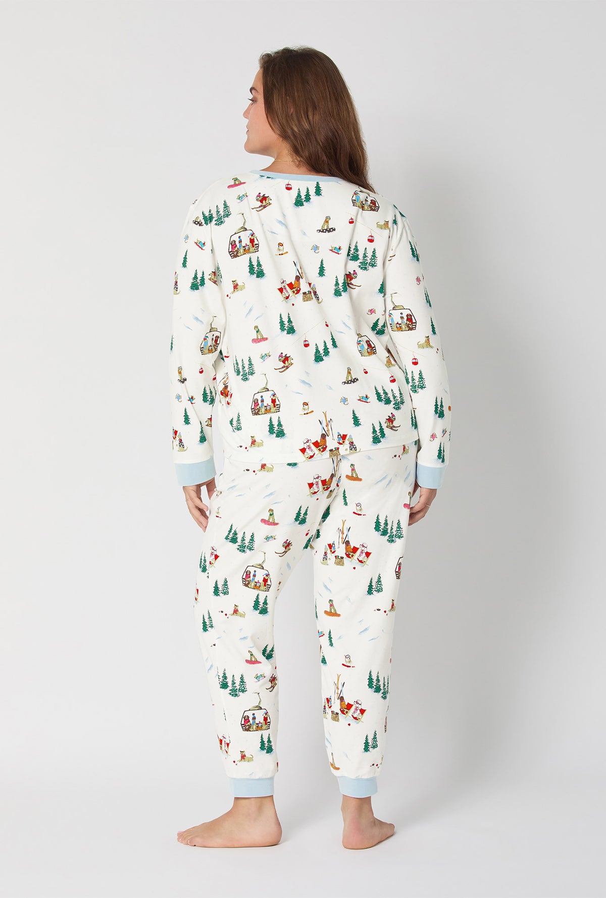 A lady wearing Ski Pups Long Sleeve Pullover Crew And Jogger Stretch Jersey Pj Set