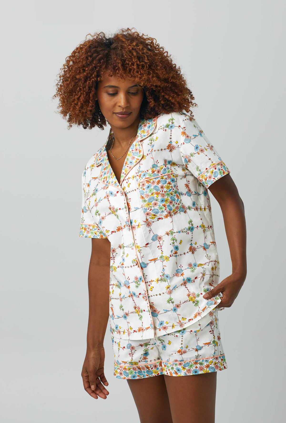 A lady wearing Short Sleeve Classic Shorty Woven Cotton Poplin PJ Set with spring vines print