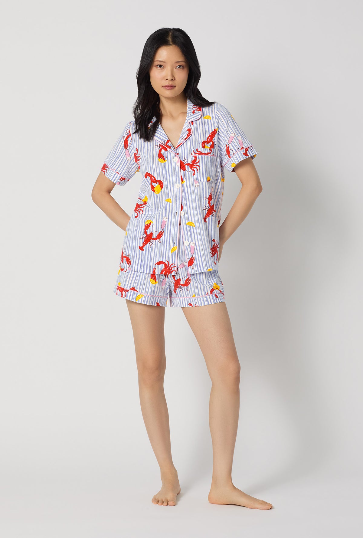 A lady wearing Coastal Feast Short Sleeve Classic Shorty Stretch Jersey Pj Set