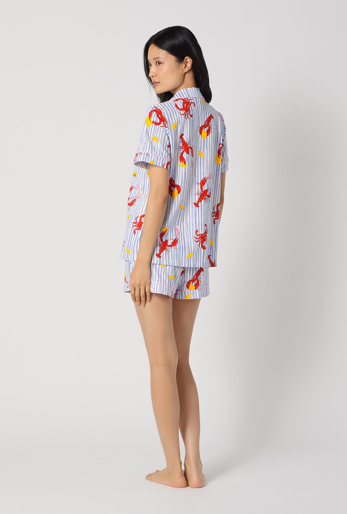 A lady wearing Coastal Feast Short Sleeve Classic Shorty Stretch Jersey Pj Set  back view