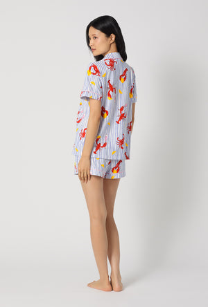 A lady wearing Coastal Feast Short Sleeve Classic Shorty Stretch Jersey Pj Set  back view