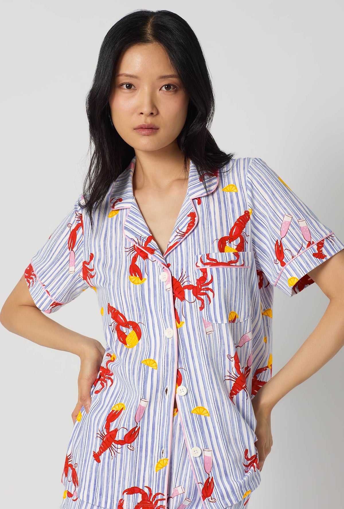 A lady wearing Coastal Feast Short Sleeve Classic Shorty Stretch Jersey Pj Set closer look