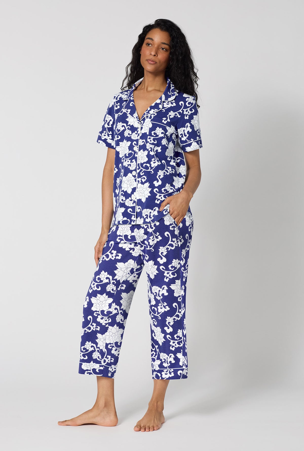 A Lady Wearing Dynasty Blue Short Sleeve Classic Stretch Jersey Cropped Pj Set in a side angled pose