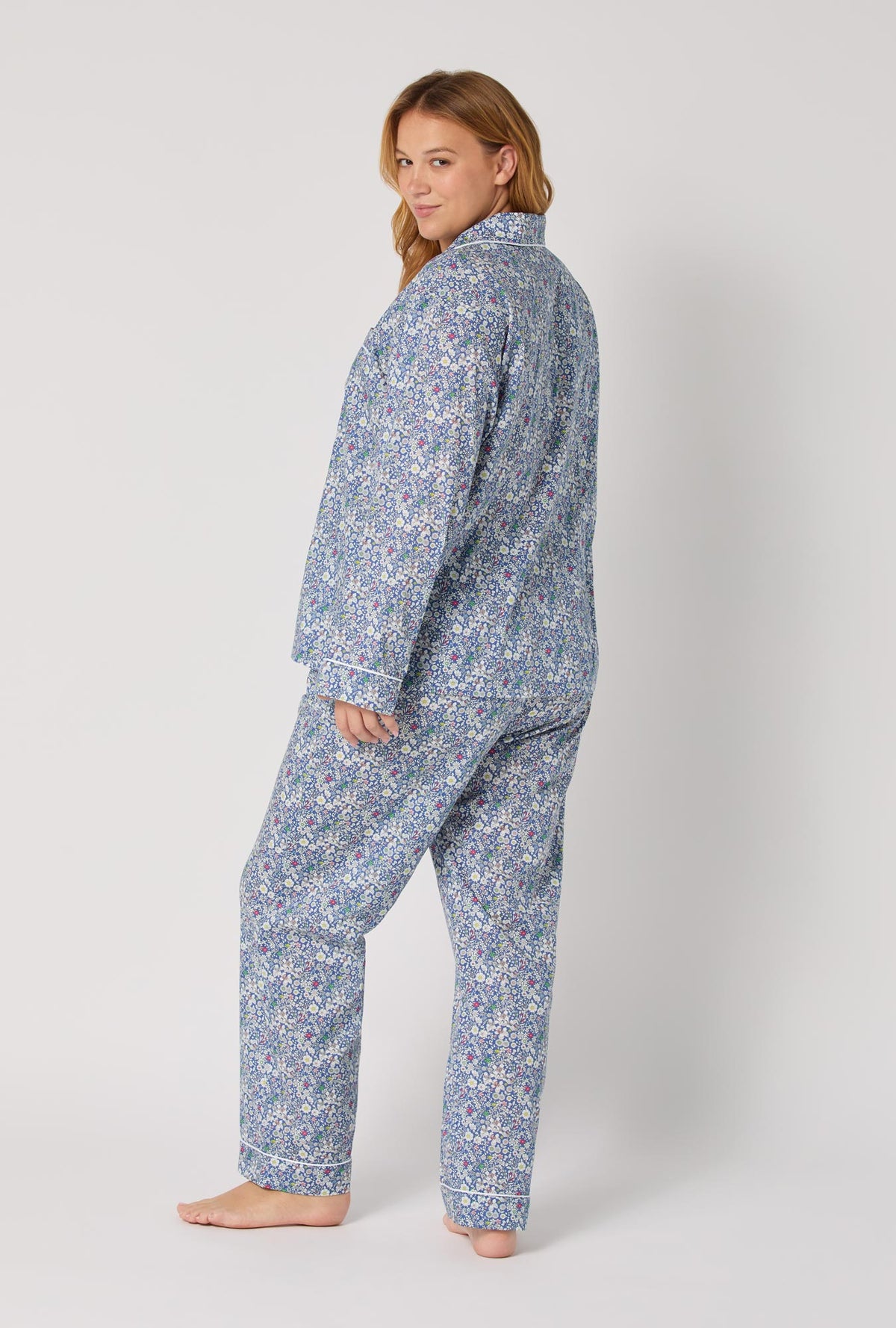 A lady wearing June's Meadow Long Sleeve Classic Woven Tana Lawn® Plus Pj Set Made With Liberty Fabric