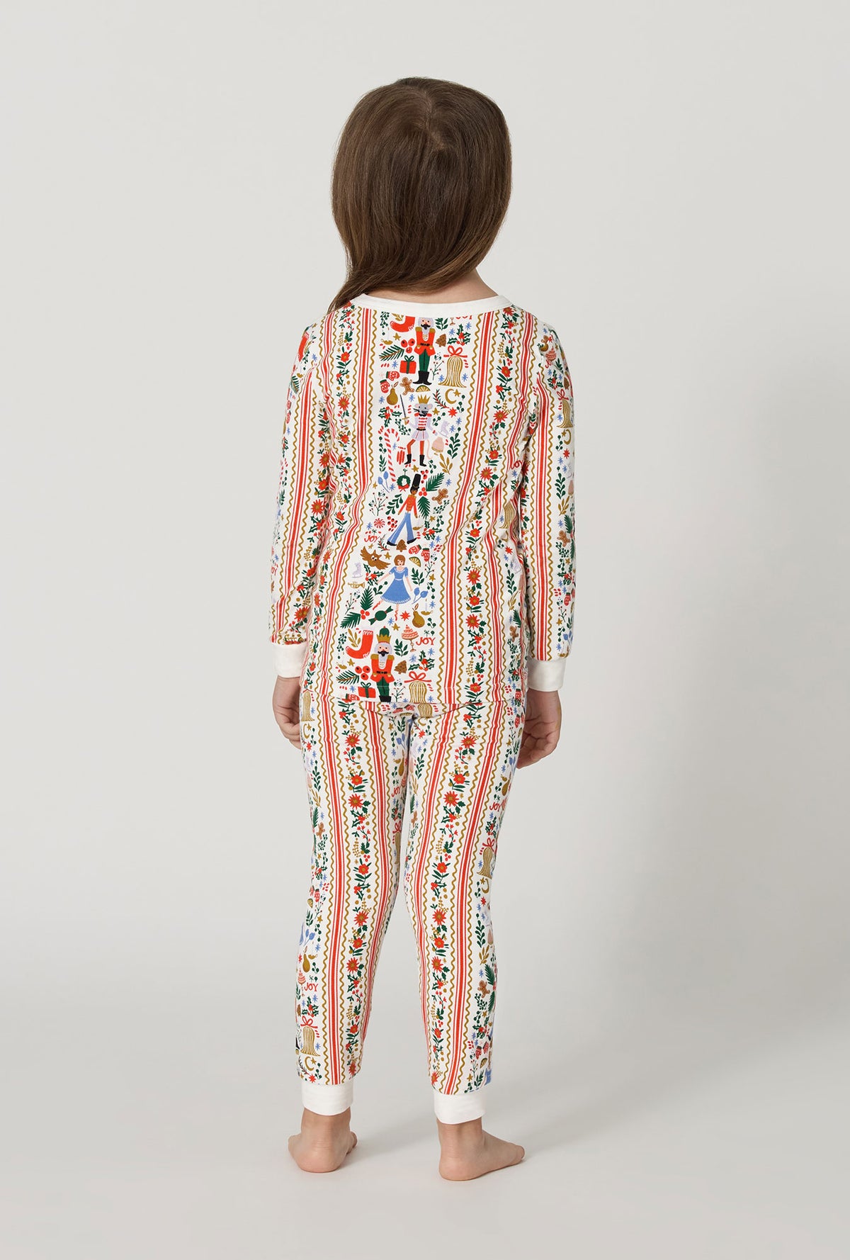 A Girl wearing Rifle Paper Co. x BedHead PJs Holly Jolly Nutcracker Long Sleeve Stretch Jersey Kids Pj Set back view
