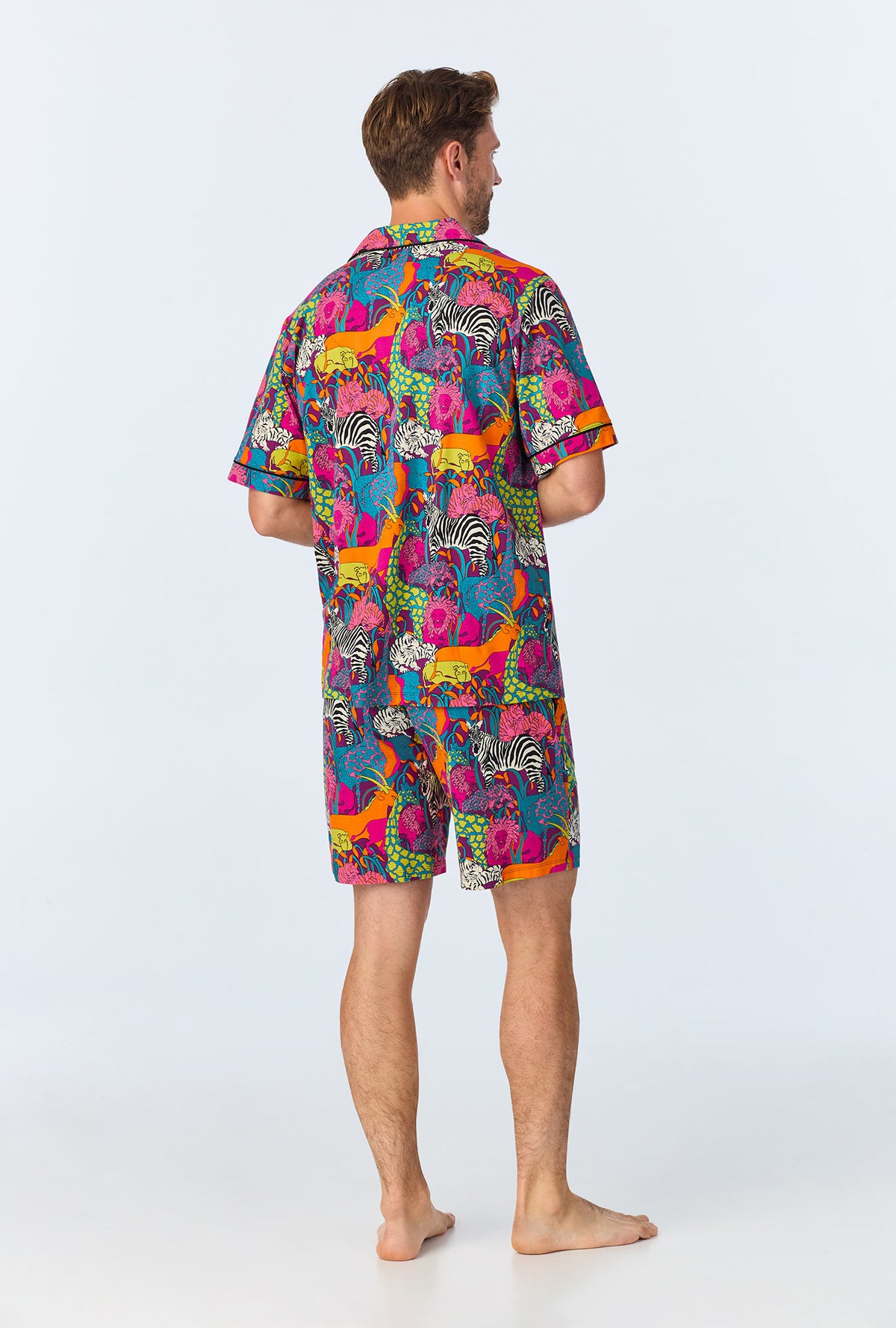 A man wearing a  Jungle Mens Short Sleeve Notch Stretch Jersey Short PJ Set