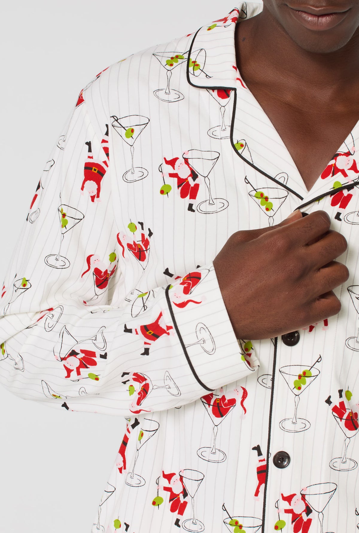 A man wearing Tipsy Santa Men&#39;s Long Sleeve Classic Stretch Jersey Pj Set