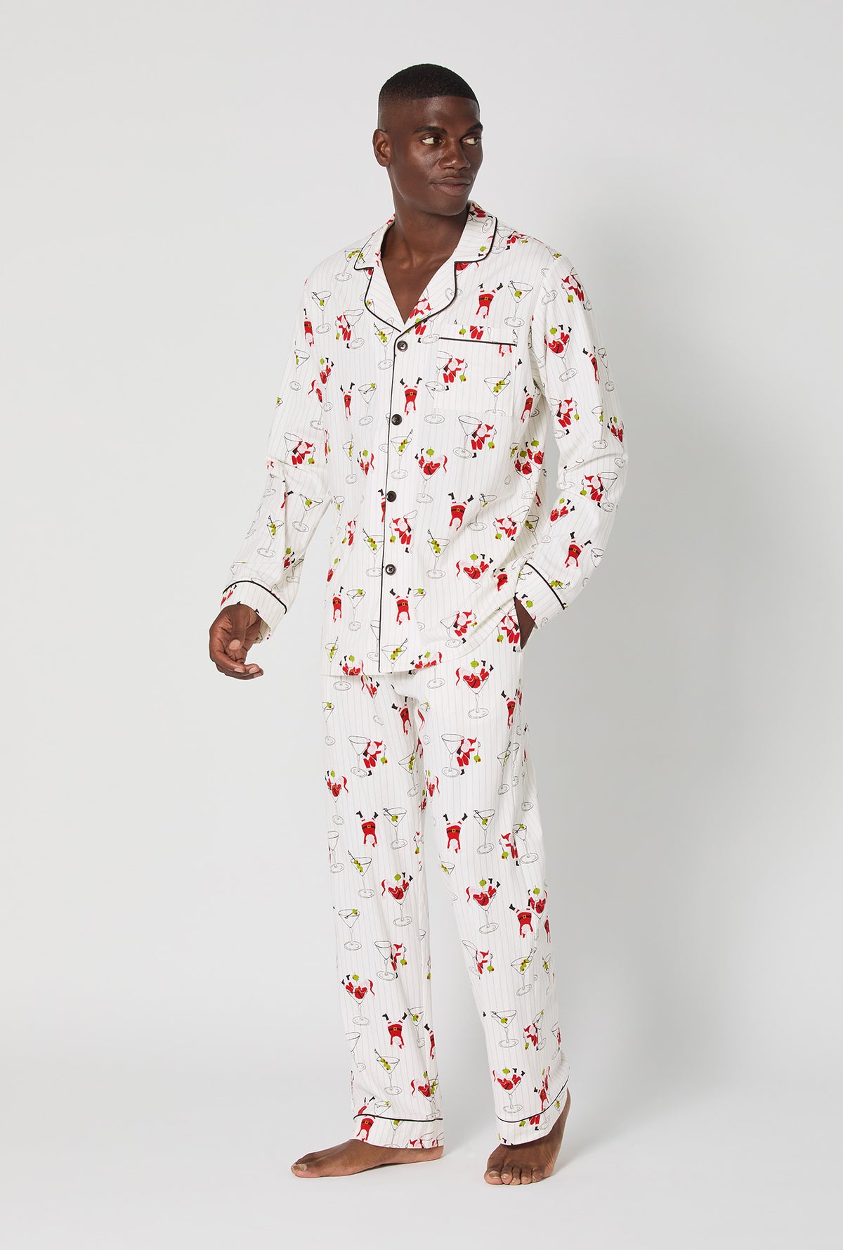 A man wearing Tipsy Santa Men&#39;s Long Sleeve Classic Stretch Jersey Pj Set
