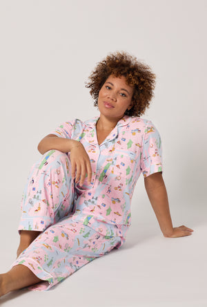 A lady wearing plus size New York, New York Short Sleeve Classic Stretch Jersey Cropped Pj Set