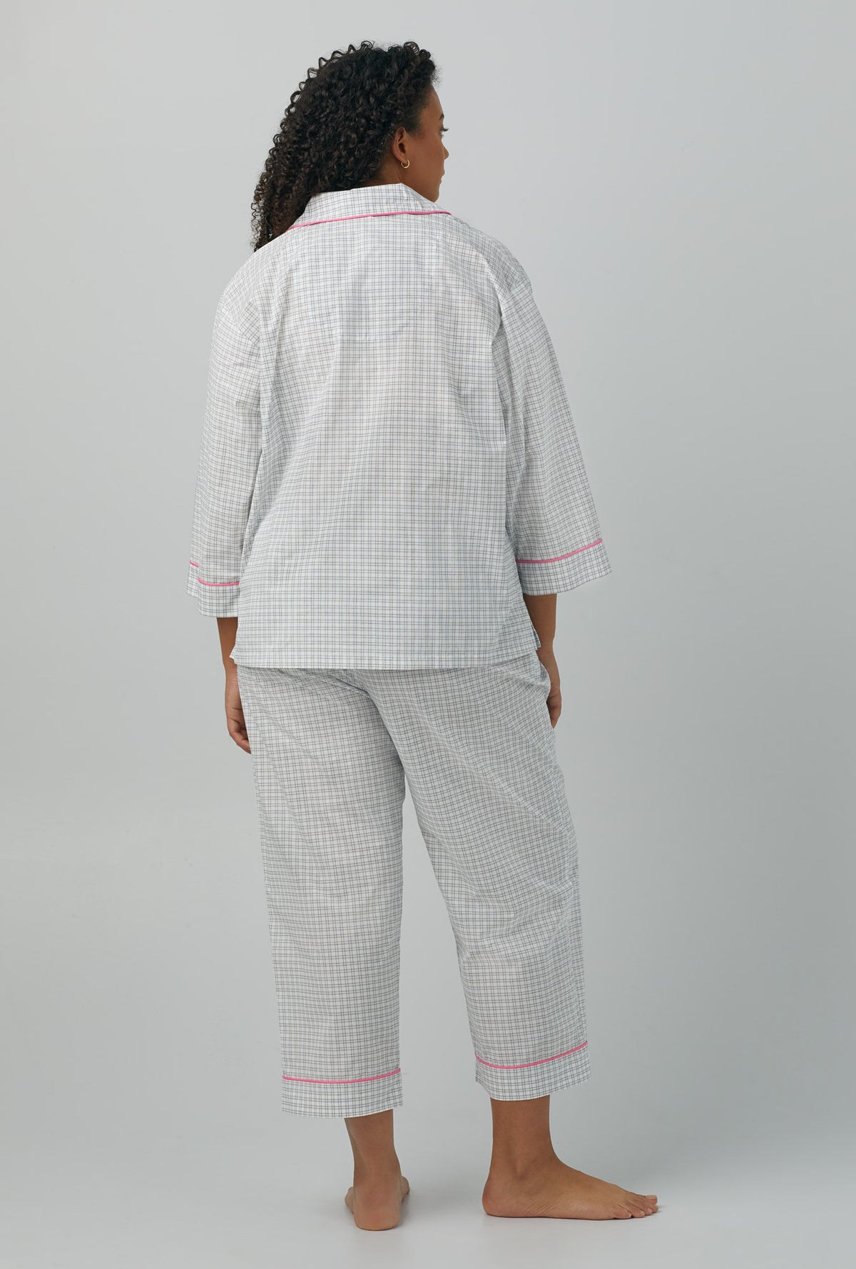 A lady wearing 3/4 Sleeve Classic Woven Cotton Poplin Cropped PJ Set with cottage plaid prints