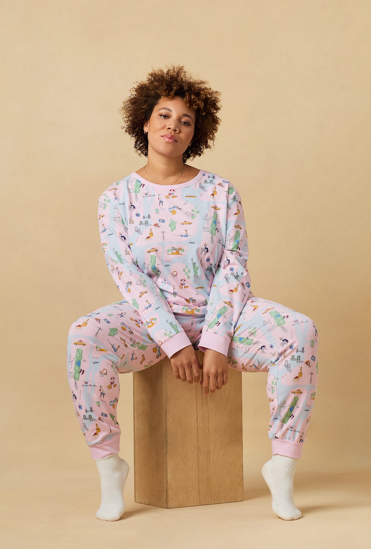 A lady wearing New York, New York Long Sleeve Pullover Crew And Jogger Stretch Jersey Pj Set