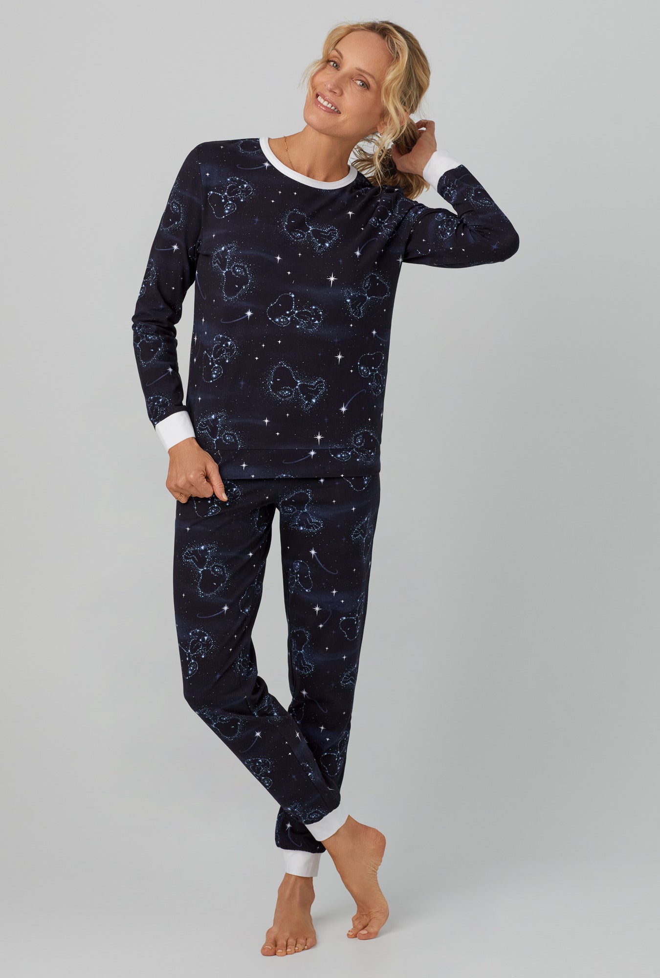 A lady wearing black  Long Sleeve Pullover Crew and Jogger Stretch Jersey PJ Set with Celestial Snoopy  print