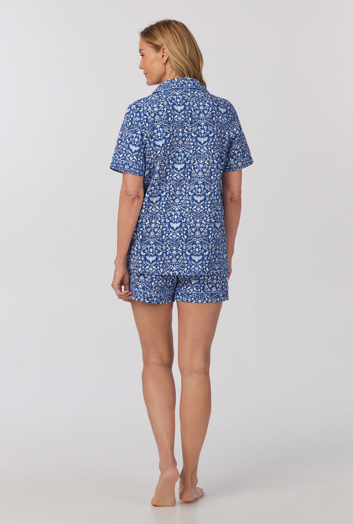 A lady wearing Short Sleeve Classic Shorty Stretch Jersey PJ Set with Through The Woods print 