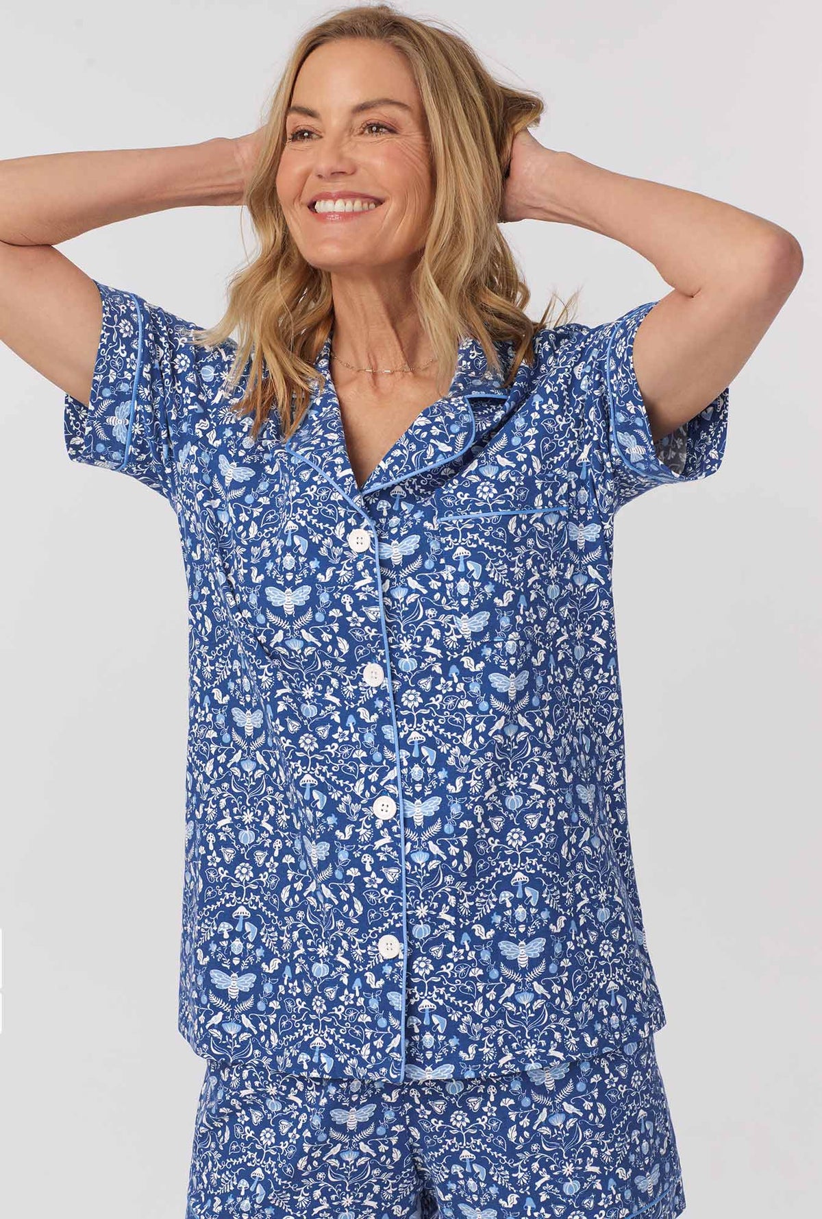 A lady wearing Short Sleeve Classic Shorty Stretch Jersey PJ Set with Through The Woods print 