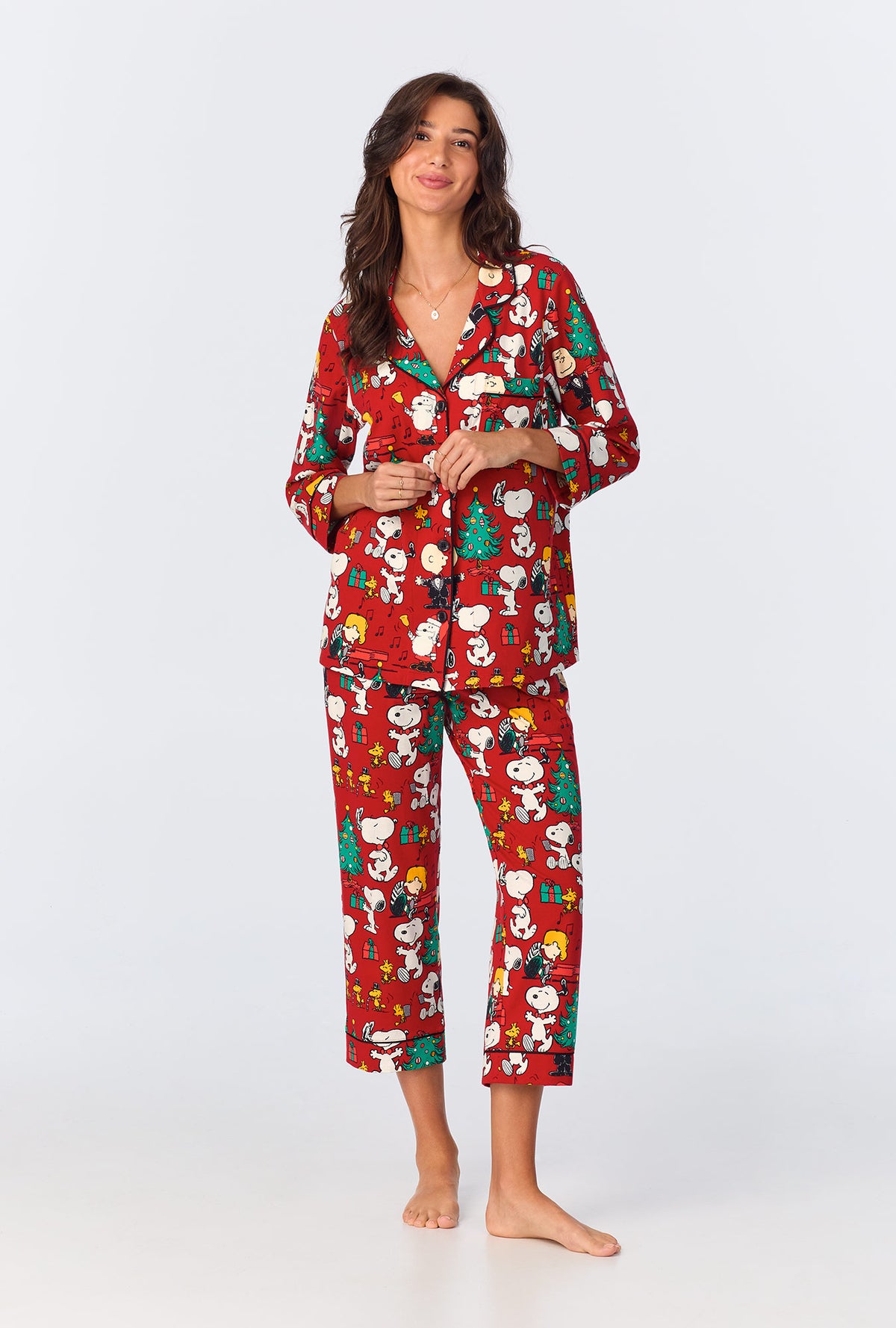 A lady wearing Peanuts® Festive Fun 3/4 Sleeve Classic Stretch Jersey Cropped PJ Set