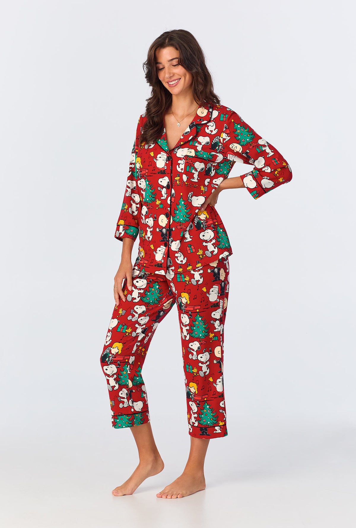 A lady wearing Peanuts® Festive Fun 3/4 Sleeve Classic Stretch Jersey Cropped PJ Set