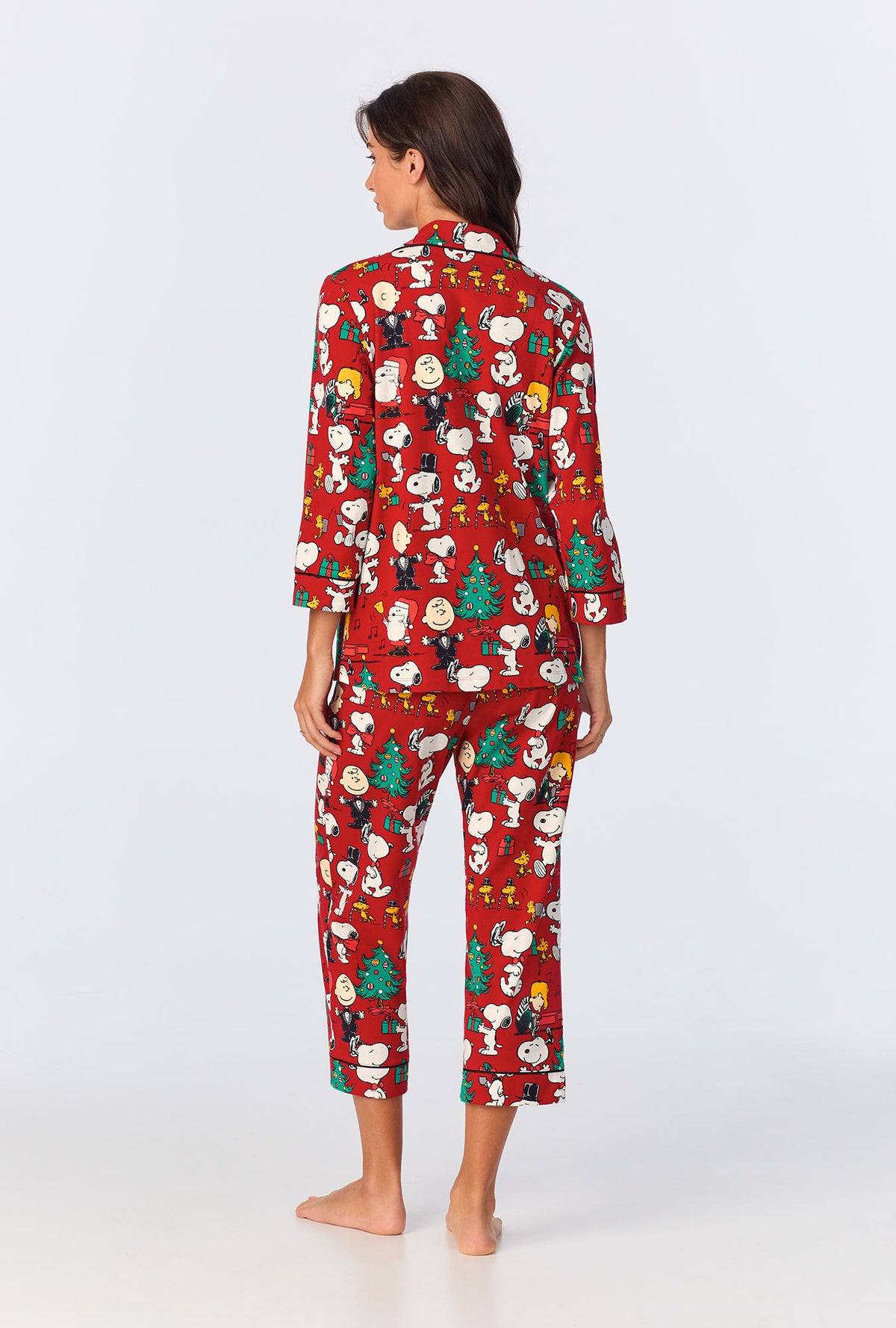 A lady wearing Peanuts® Festive Fun 3/4 Sleeve Classic Stretch Jersey Cropped PJ Set