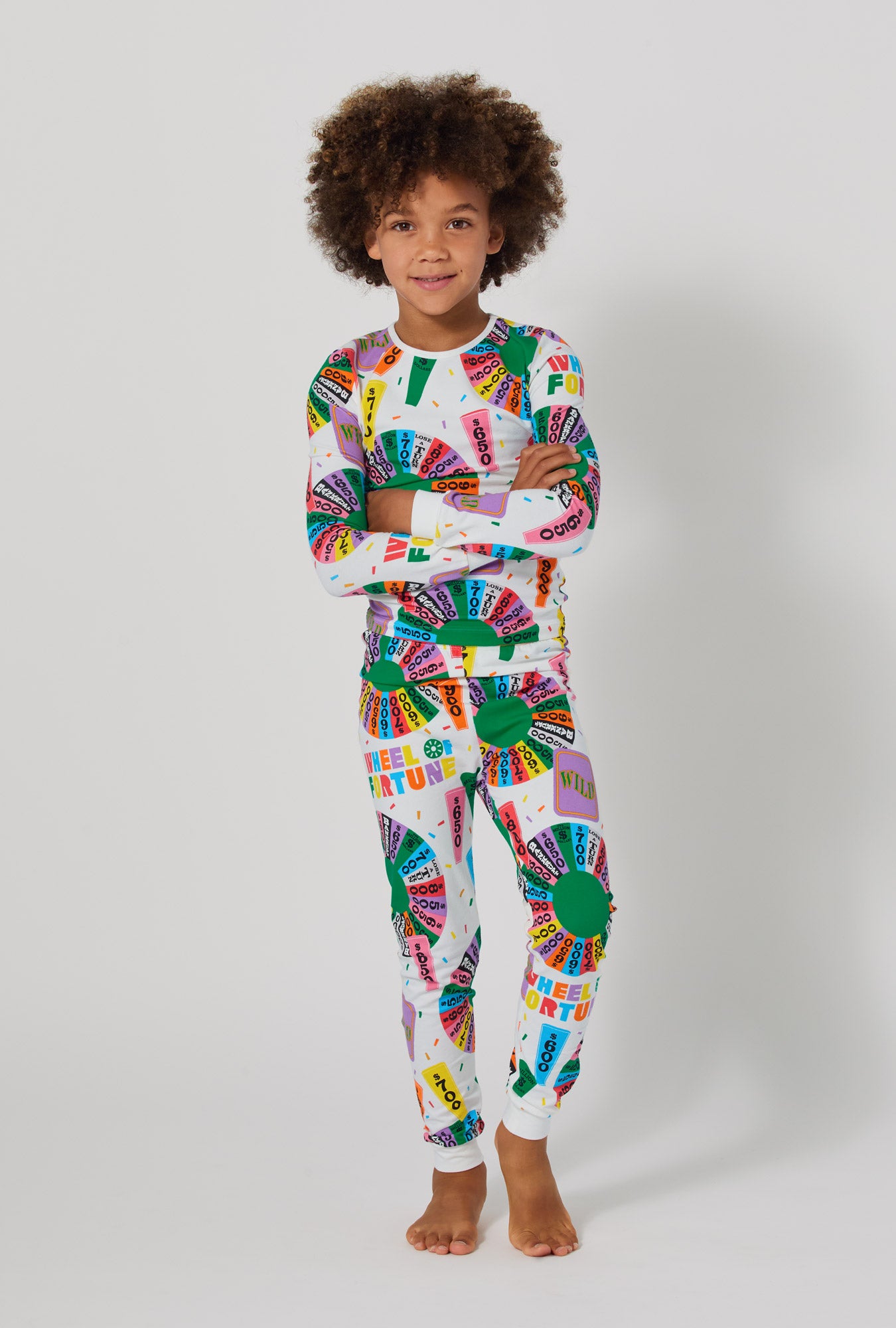 A boy wearing Wheel Of Fortune Long Sleeve Stretch Jersey Kids Pj Set
