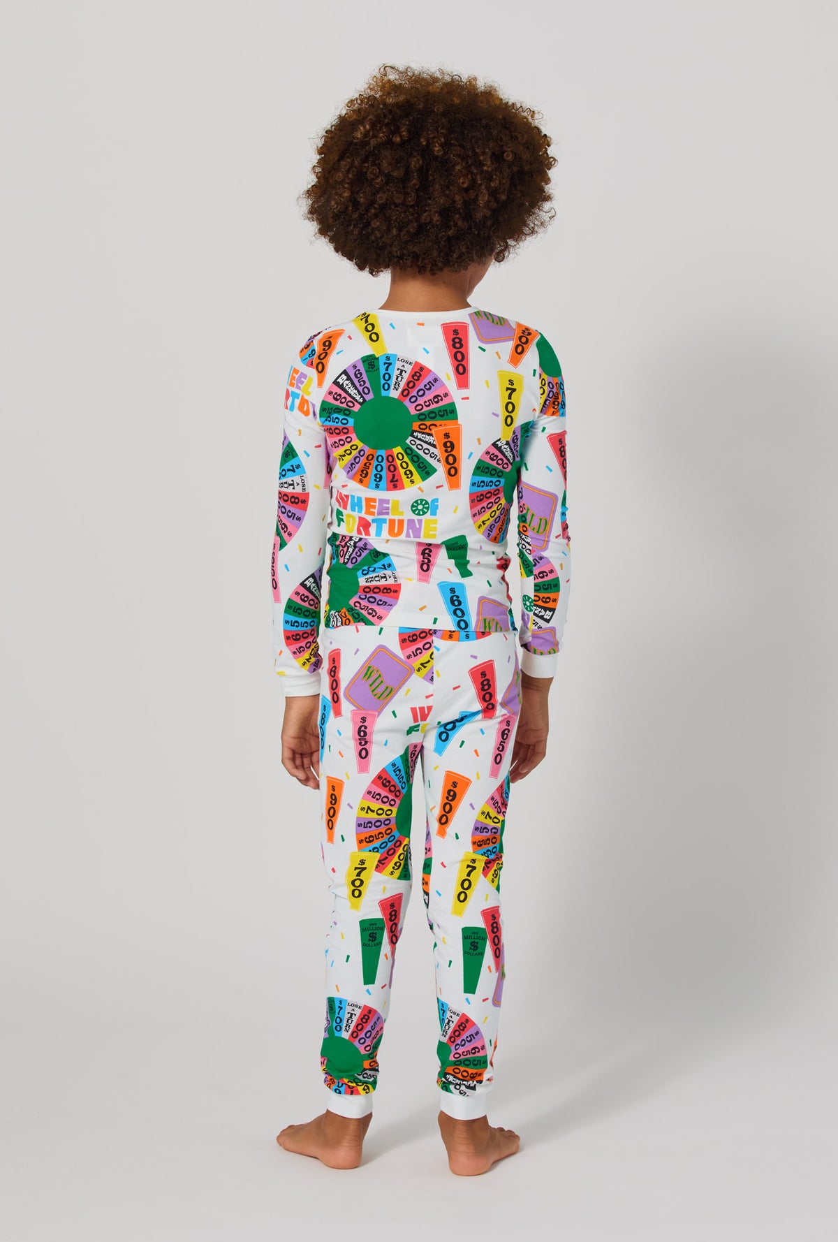 A boy wearing Wheel Of Fortune Long Sleeve Stretch Jersey Kids Pj Set