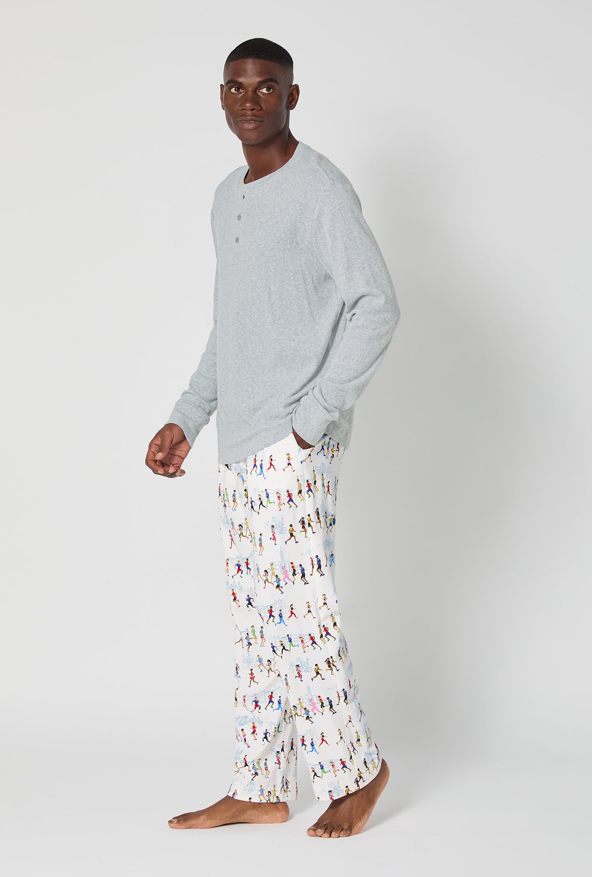 A man wearing Run NYC Run Men's Long Sleeve Henley Stretch Jersey Pj Set