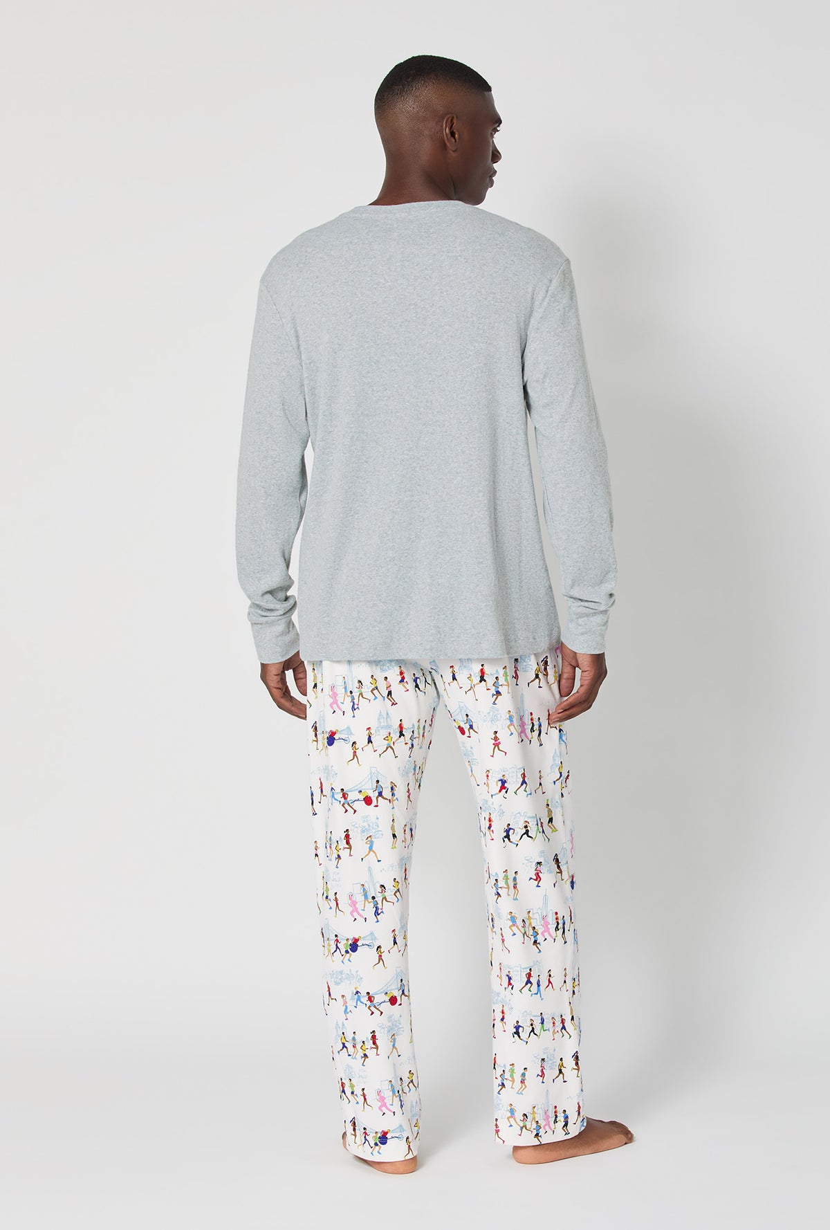 A man wearing Run NYC Run Men's Long Sleeve Henley Stretch Jersey Pj Set