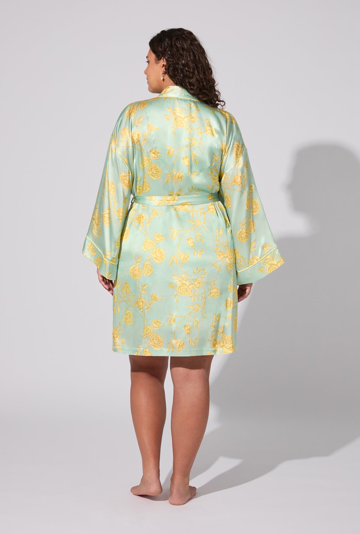 A lady wearing Royal Roses Woven Washable Silk Satin Robe