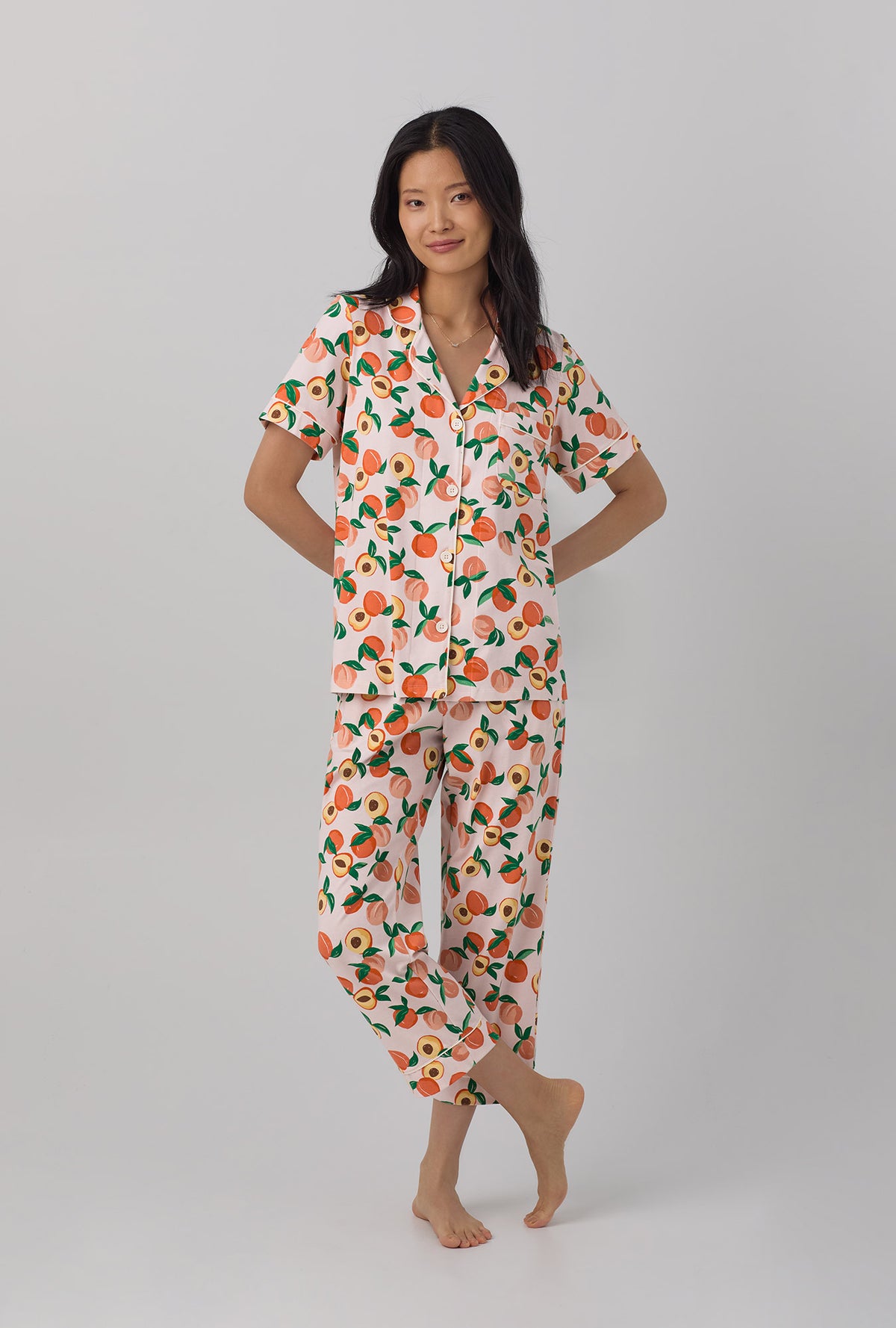 A lady wearing Short Sleeve Classic Stretch Jersey Cropped PJ Set with Peachy Keen print
