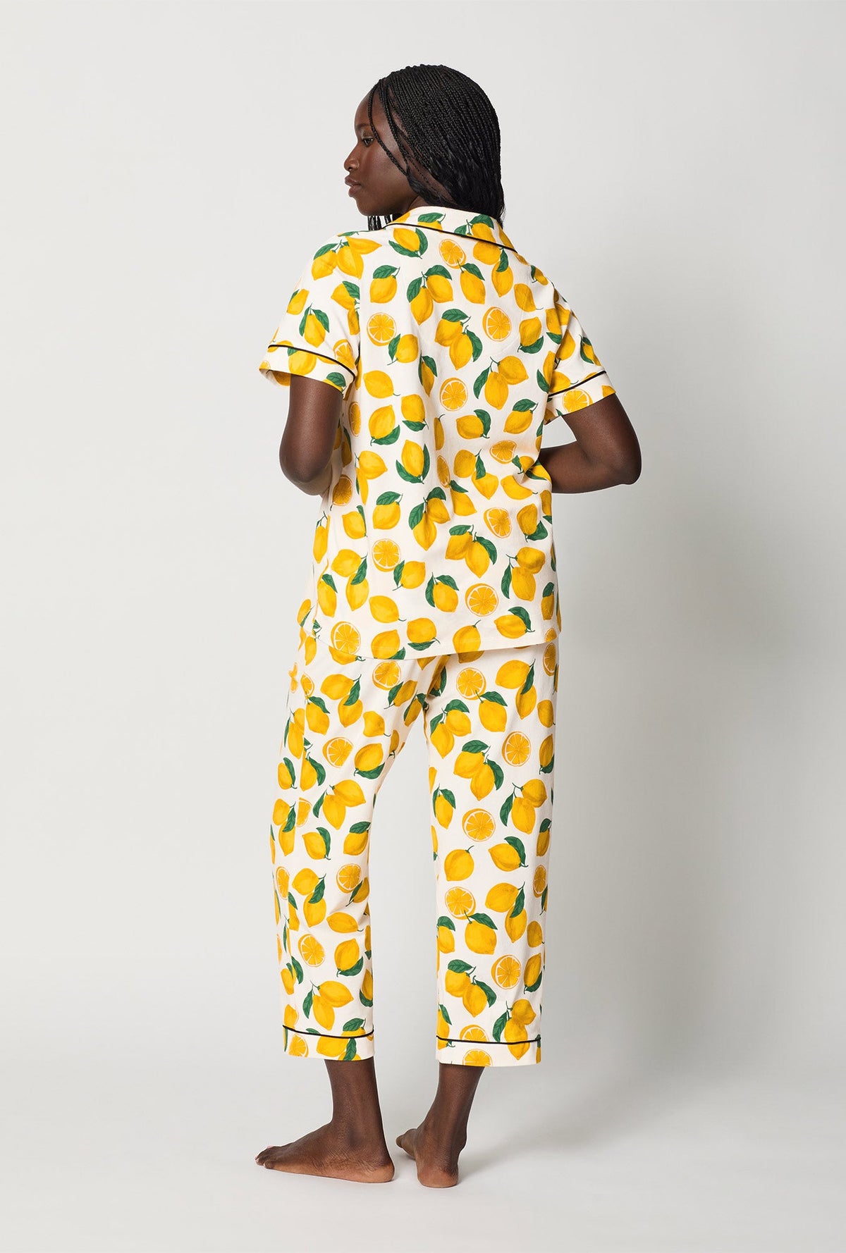 A lady wearing White and  Yellow Short Sleeve Classic Stretch Jersey Cropped Pj Set back view