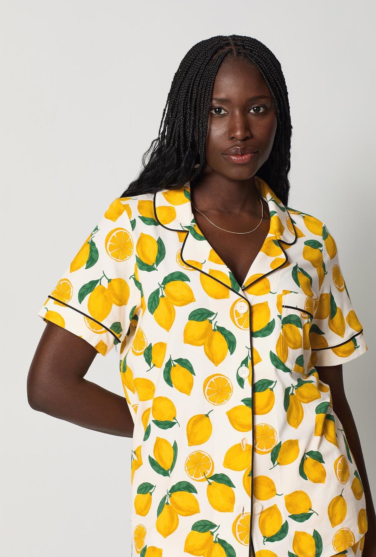 A closeup of A lady wearing White and  Yellow Short Sleeve Classic Stretch Jersey Cropped Pj Set