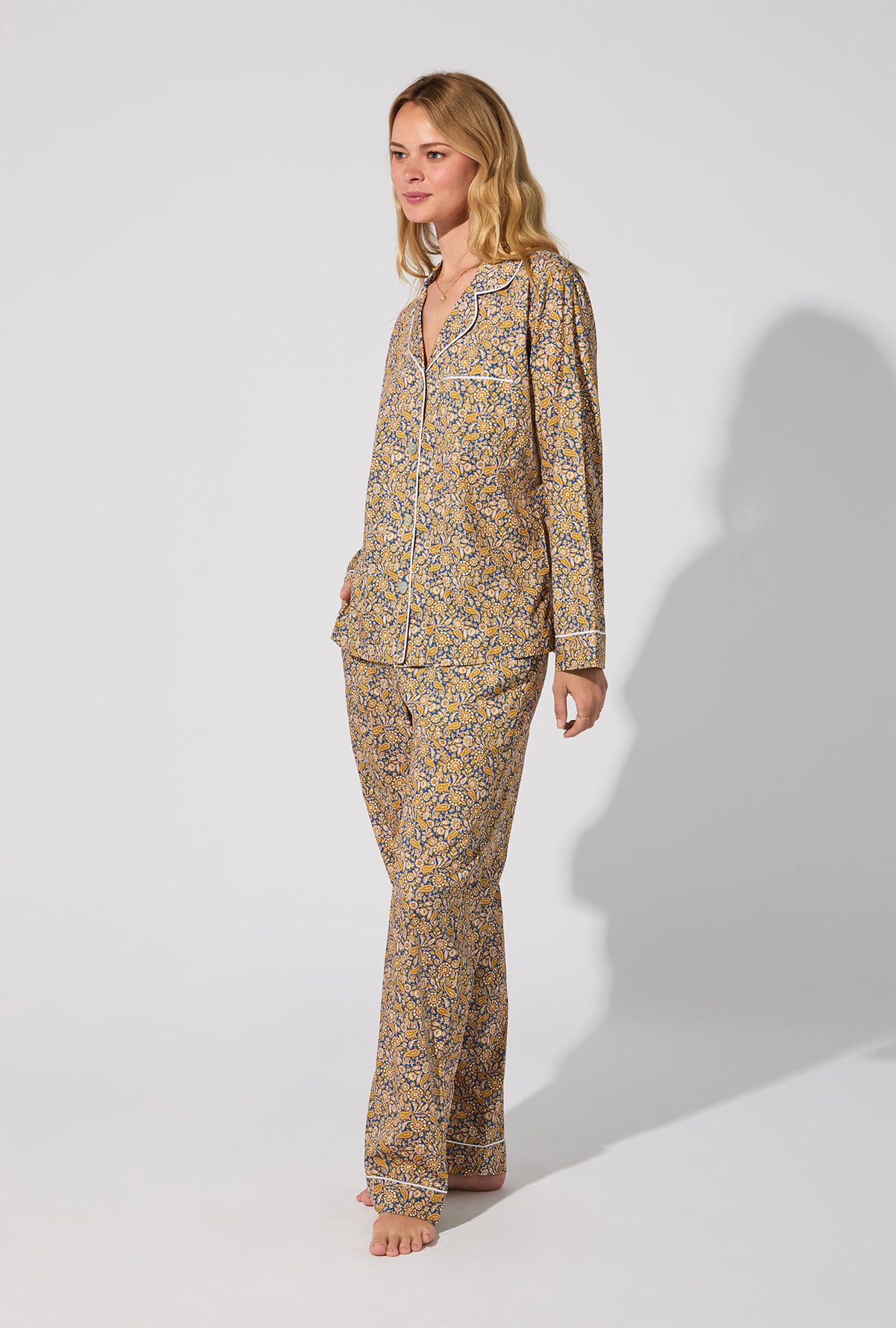 A lady wearing Theodore Manor Long Sleeve Classic Woven Tana Lawn® PJ Set Made With Liberty Fabric