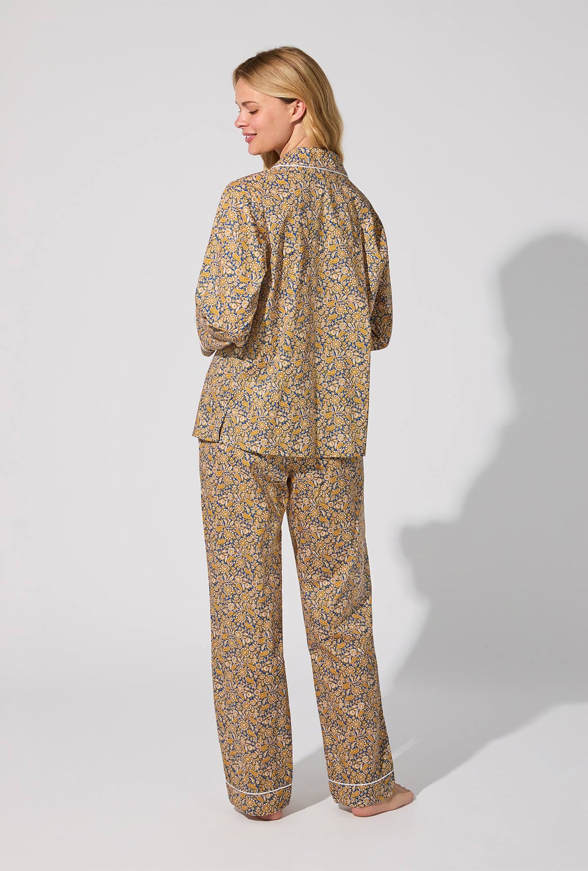 A lady wearing Theodore Manor Long Sleeve Classic Woven Tana Lawn® PJ Set Made With Liberty Fabric
