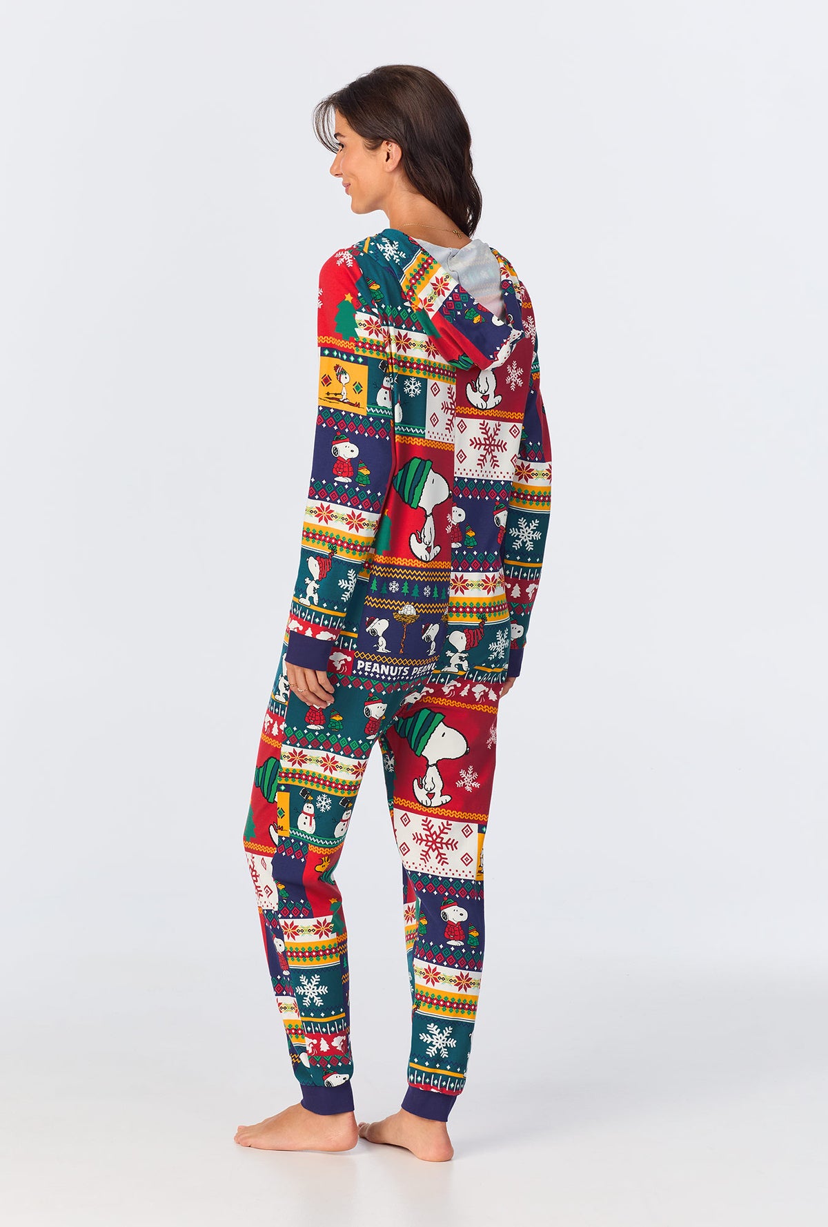 A lady wearing fairisle snoopy long sleeve onesie