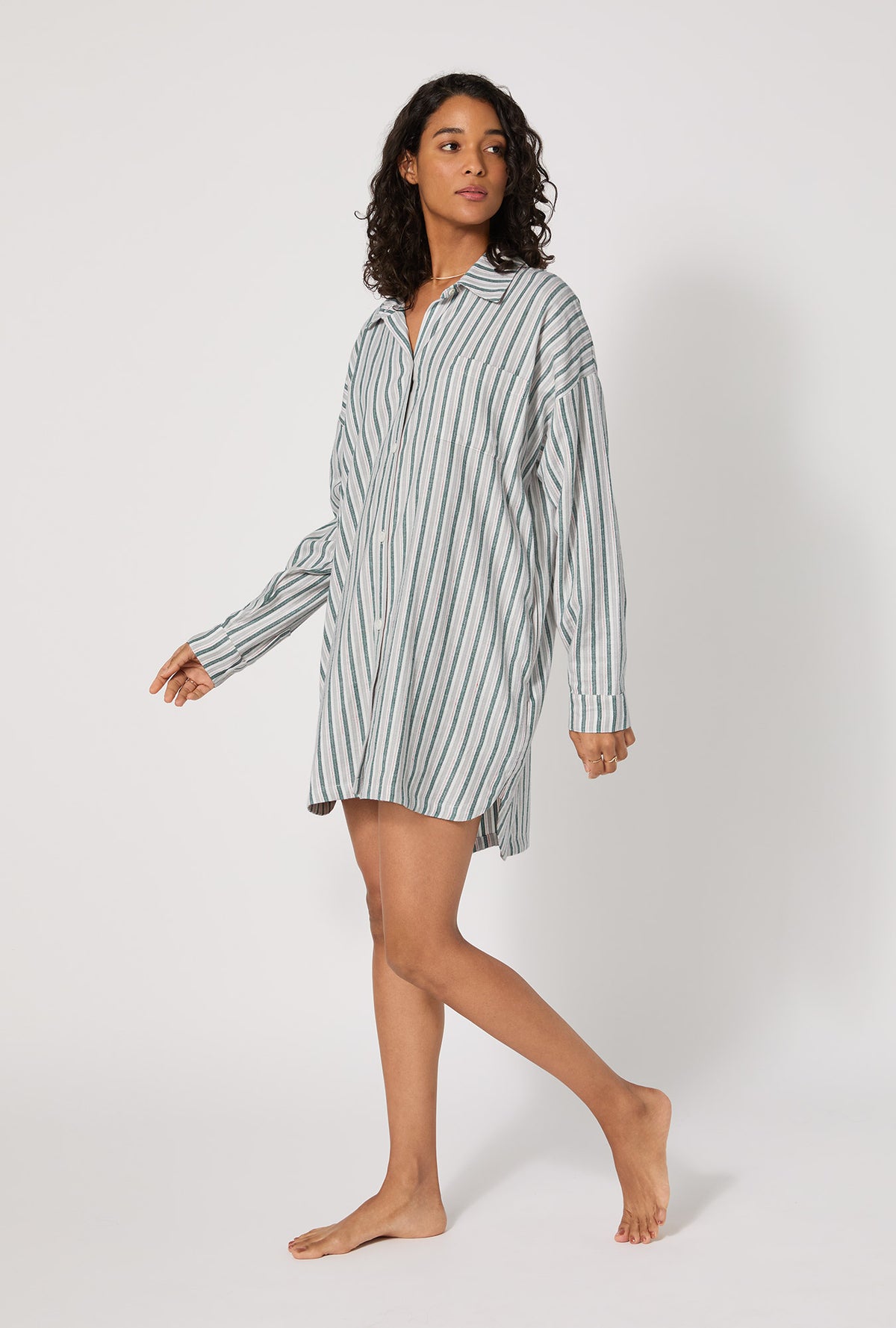 A lady wearing Peppermint Stripe High Low Woven Portuguese Flannel Boyfriend Shirt