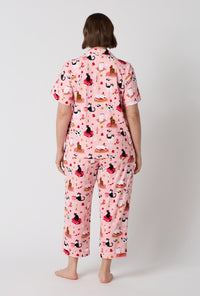 A Lady Wearing Plus Size Bazaar Cats Short Sleeve Classic Stretch Jersey Cropped Pj Set in a back view pose