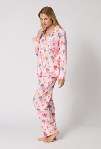 A Lady Wearing Serene Sunrise Long Sleeve Classic Stretch Jersey Pj Set in a side angled pose