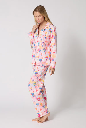 A Lady Wearing Serene Sunrise Long Sleeve Classic Stretch Jersey Pj Set in a side angled pose